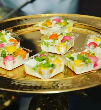 A platter of our fusion Bengali sweets. These colorful, bite-sized treats combine traditional flavors with modern presentation, making the wedding buffet look versatile and lip-smacking.