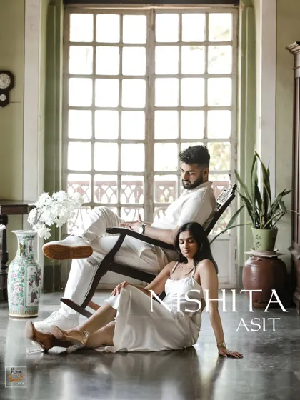 A stylish pre-wedding portrait inside a heritage home in Goa, showcasing a blend of vintage charm and modern romance.