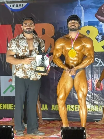 On stage with my client as he wins the 85kg gold medal. A proud moment for any coach.
