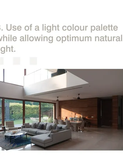 We use a light color palette and maximize natural light to create the illusion of a larger, more open space. This double-height living room feels expansive and airy, connecting directly to the garden outside.