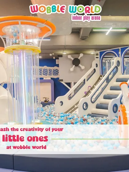 Our space-themed play structure is designed to unleash creativity. This wide shot shows how different elements connect to create an imaginative world.