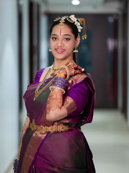 Another portrait of Sahana, showcasing the elegance of her bridal look and the deep, beautiful color of her henna.