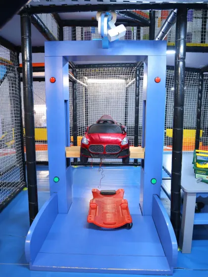 This unique car lift is part of our toddler zone, allowing little ones to engage in imaginative, mechanical play.