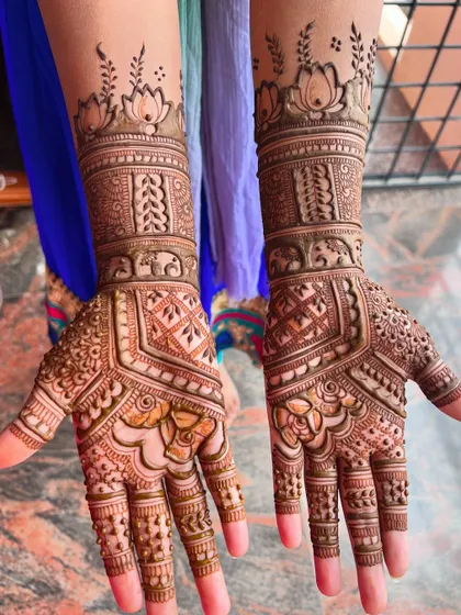 A full view of the engagement mehendi, showcasing the beautiful lotus and elephant motifs.