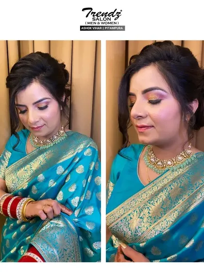 Elegance in every detail. This client is dressed in a beautiful turquoise silk saree, and her makeup is kept classic with a simple updo, defined eyes, and a soft lip color.