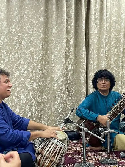 A moment of musical conversation during an intimate recital. Here, I am performing with Satyajit Talwalkar on tabla, exploring the nuances of the raag for an appreciative audience.