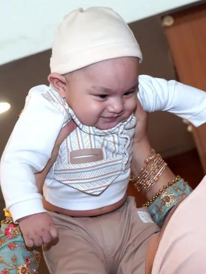 The pure joy of a baby being lifted in the air. These are the spontaneous, love-filled moments between parents and children that make the most precious memories.