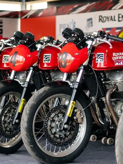 Our fleet of red Continental GTs lined up in the pits. The sight of these bikes ready to go is enough to get any rider's adrenaline pumping.