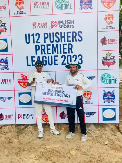 A young player receiving the 'Player of the Match' award at the U12 Pushers Premier League 2023. We believe in recognizing and encouraging young talent.