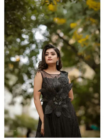The elegant silhouette of this black gown is perfect for creating sophisticated and memorable pre-wedding or evening event photos.