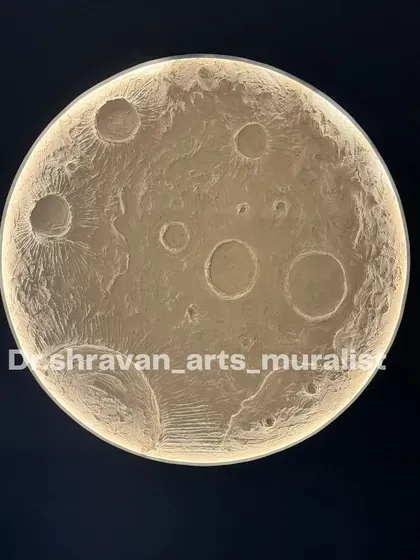 A close-up shot of a completed moon mural. You can really see the detail and texture of the hand-sculpted craters. The integrated lighting gives it a soft, ethereal glow.
