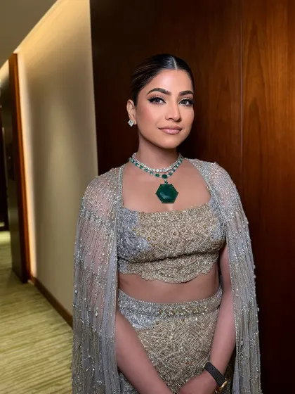 A beautiful, elegant look for a special evening event. The makeup is clean and classic, with a focus on flawless skin.