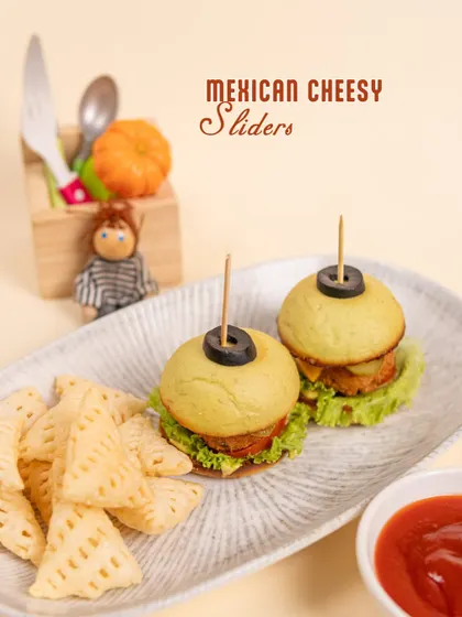 Our Mexican Cheesy Sliders are a big hit! These mini burgers are perfectly sized for little hands and come with a side of crispy snacks.