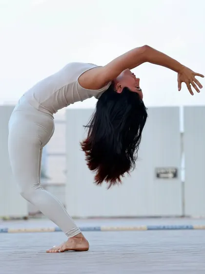 A standing backbend, opening the heart to the sky. This pose is about letting go of what no longer serves you and feeling lighter in your own body.