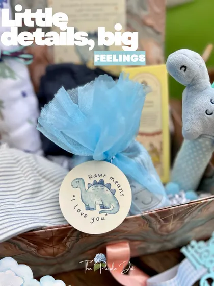 The little details are where the feelings live. This close-up shows a custom tag from the dinosaur-themed hamper, with the message "Rawr means I love you," adding a layer of sweetness to the gift.