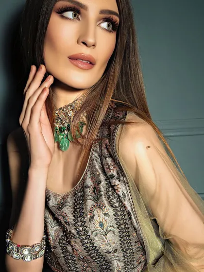 A beauty close-up focusing on the model's profile and the delicate jewelry. This type of shot emphasizes elegance and is perfect for showcasing accessories in a subtle way.