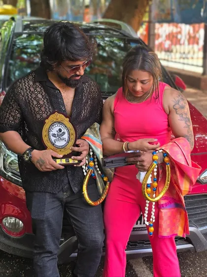 A candid moment after the event, looking at the awards. It's a reminder of the hard work and a celebration of the achievement.