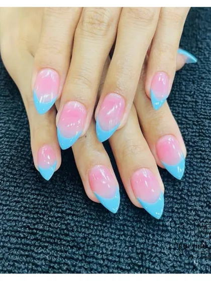 A soft and dreamy look with these sky blue French tips on a pink ombre base. This color combination is perfect for a subtle pop of color.