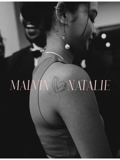 Details tell a story. The bride's tattoo, her gentle smile, and the groom's laughter in the background create a layered, intimate portrait. I use black and white to strip away distractions and focus purely on emotion and connection.