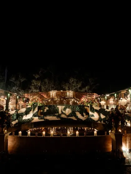 The grand fountain at the entrance, surrounded by candles. This served as the focal point of the romantic garden that greeted guests as they entered the 'Lost City'.