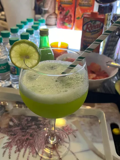 A vibrant green mocktail, refreshing and delicious. We take pride in our creative non-alcoholic drink menu.