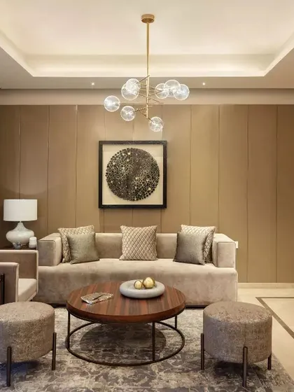 A contemporary living room from the Emaar DigiHomes project, with a neutral palette and modern lighting.