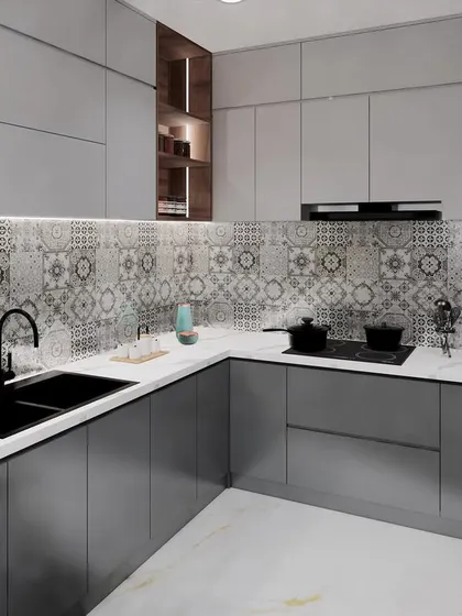 A minimalist kitchen in shades of grey, with patterned Moroccan-style tiles for the backsplash adding a decorative element.
