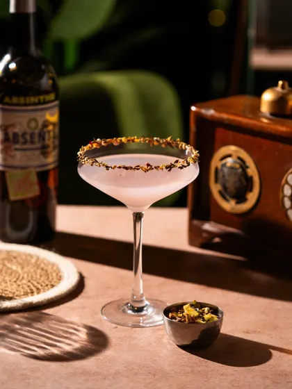 An absinthe cocktail with a beautifully garnished rim. The details matter, and I focus on capturing the craftsmanship that goes into each drink.
