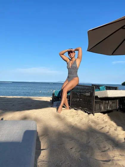 Enjoying a sunny day at the beach. Feeling confident and strong in my body is one of the best results of a consistent fitness routine.