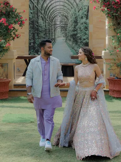 This is what a Haldi Carnival dream looks like. For Aashvi and Akash, we created coordinated pastel and lavender looks that were fresh, elegant, and fun. I designed and produced a custom tone-on-tone purple kurta set with a jacquard jacket for the groom, while the bride wore a stunning mirror-work lehenga.