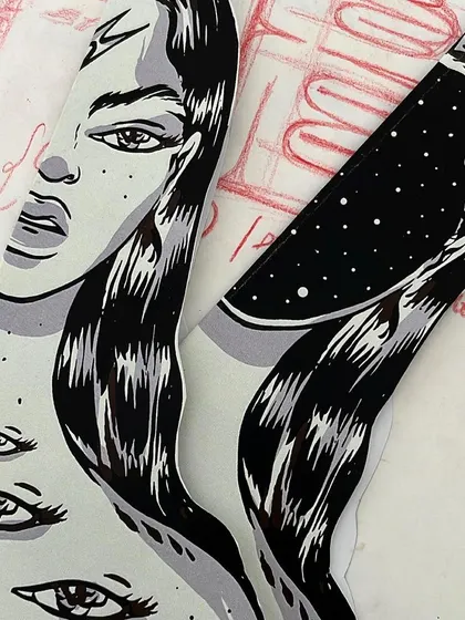 A process shot showing the paper illustration cutouts for 'Confrontation' alongside my initial sketches.