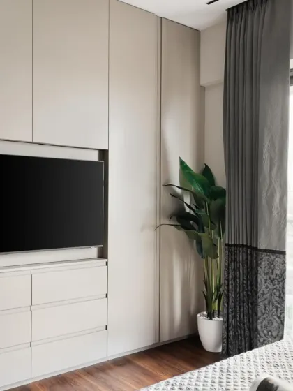 A side view showing how the entire built-in unit sits flush against the wall, extending right up to the window to maximize storage without overwhelming the room.
