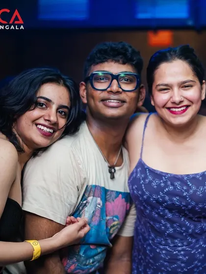 Friends coming together to enjoy the music and celebrate. The crowd is the heart of the party.