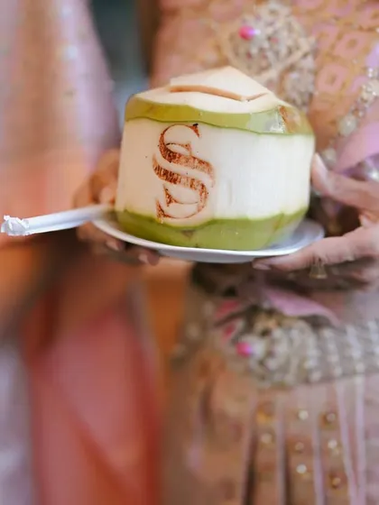 A custom-branded coconut for guests upon arrival, a refreshing and personalized welcome.