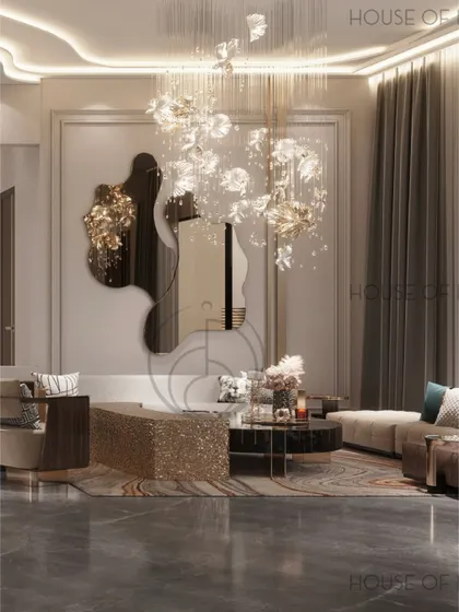 We wanted this living room to feel like a pause. The space is soft and glowy, with a floral-inspired chandelier, an artistic mirror, and a mix of metallic and textured furniture that invites you to sit down and stay awhile.