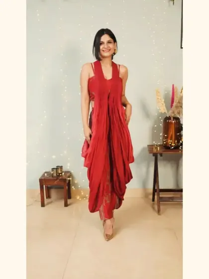 The beautiful Anupriya Kapur in our red draped dress. This piece is all about fluid fabrics and eclectic cuts, bringing a touch of modern elegance and sustainability to your festive look.