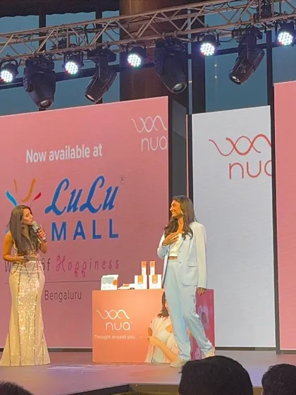 Sharing a moment on stage with the event host. Collaborating with event organizers and brands like Nua allows me to bring important conversations about women's health and menstrual hygiene to the forefront.