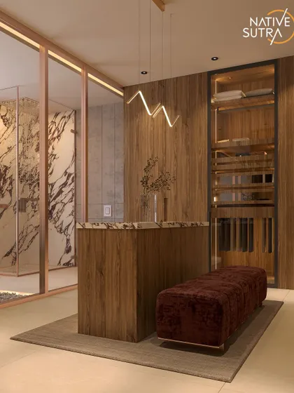 Luxury is in the details. This Zen Luxe dresser space combines a plush velvet ottoman, a marble-topped island, and modern pendant lighting to create a refined and timeless ritual space.