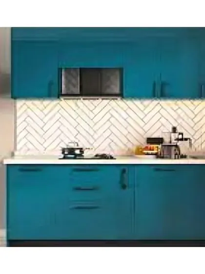 A simple and effective straight-line kitchen, ideal for a studio apartment or small home. The teal cabinets and herringbone backsplash add a splash of modern style.