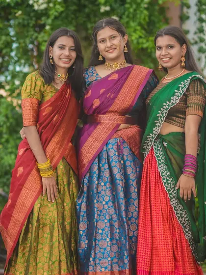 A lovely group portrait of three women in colorful traditional sarees. I ensure everyone looks comfortable and natural in group photos.