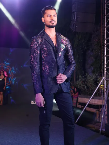 Modeling a sheer lace blazer with floral embroidery for a New Year's Eve event. This look is edgy, festive, and high-fashion.