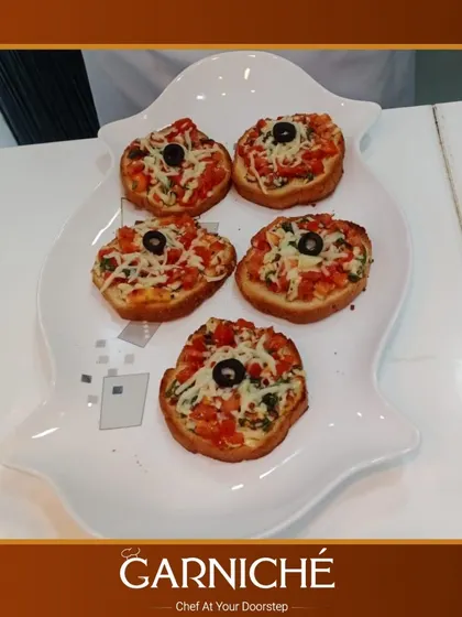 Looking for some Italian flair? We prepare these delicious bruschetta bites, topped with fresh tomatoes, cheese, and olives, perfect for passing around as an appetizer.