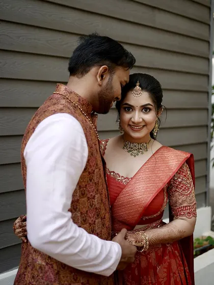 An intimate couple moment. The bride's makeup is natural and glowing, designed to make her feel beautiful and confident.
