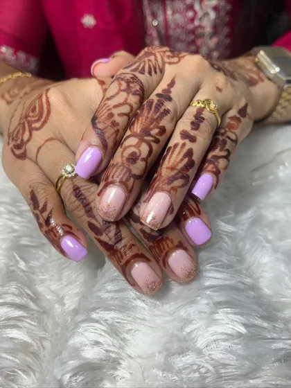 Another view of the lavender and nude glitter gel polish on natural nails. It's a soft and elegant color combination that is perfect for daily wear.