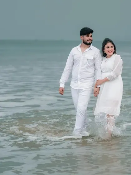 A simple, romantic walk along the shore. We capture the natural interaction between a couple, with the waves and the sea creating a perfect, serene backdrop for their love story.