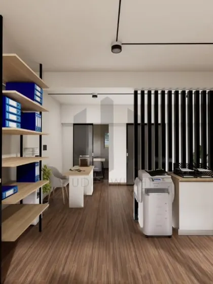Storage and circulation are key to a functional office. Here, open shelving provides easy access to files, while the clean pathways reduce visual clutter. Every element is designed to support clarity and reduce mental fatigue in a high-focus environment.