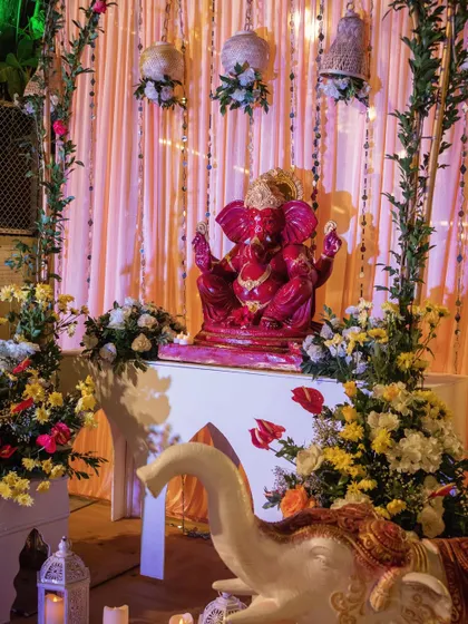 A divine Ganpati setup at the wedding entrance to welcome guests with blessings for the auspicious occasion.
