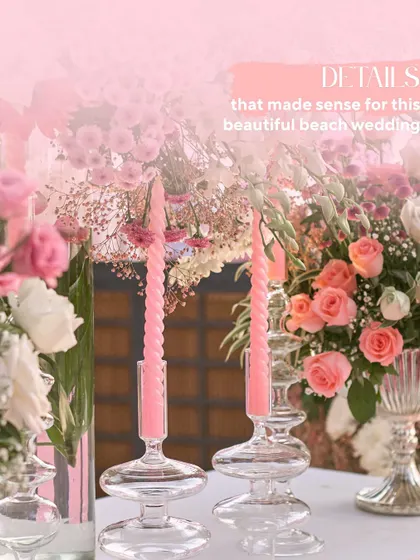 Details that make sense for a beach wedding. The combination of modern glass candle holders, pink spiral candles, and soft florals creates a look that is both chic and romantic.