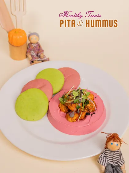 A healthy and colorful treat of Pita & Hummus. We make our hummus with beetroot for a fun pink twist that kids love.