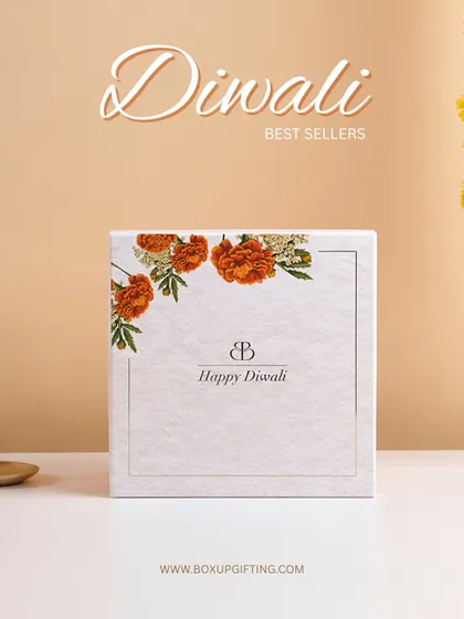 Simple, elegant, and festive. This "Happy Diwali" box with a marigold floral design is one of our bestsellers, loved for its classic and understated look.